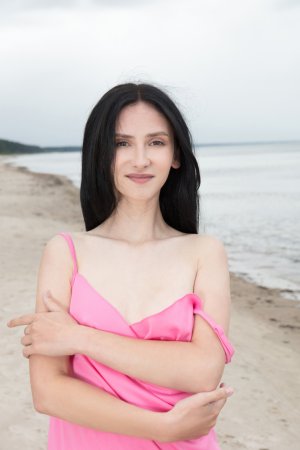 Malia bares all on the sandy shore, pink wrap slipping as she poses with a naughty grin — Malia #4