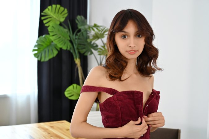 Ashly Rabbit teases in white underwear and red shirt, posing solo on office table with plant backdrop — Ashly Rabbit #2