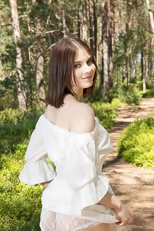 Ivanna L bares all in the forest, teasing in white lace as sunlight catches her bare skin and slow undress