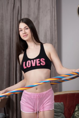 Blanca teases in pink shorts and black sports bra, hula hooping then stripping bare on the red couch — Blanca #1