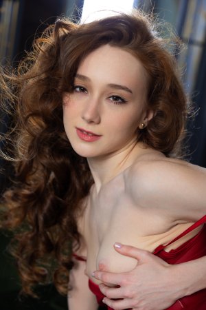 Alice Mido whispers desire in red lace, curvy solo poses on green couch, freckled skin glowing — Alice Mido #9