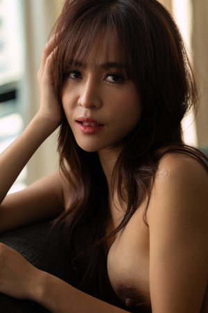 Tonnam teases in yellow lingerie posing solo on the couch with her big tits and ass on display — Tonnam #24