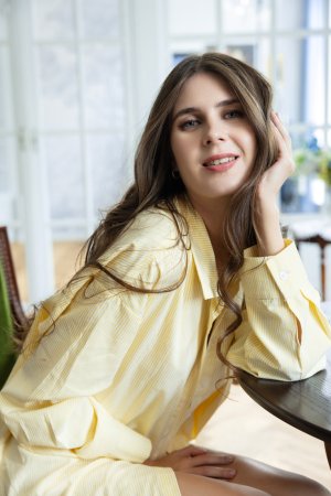 Luna Moonie strips her yellow shirt bare, posing nude on wooden floors with legs spread wide for the camera — Luna Moonie #1