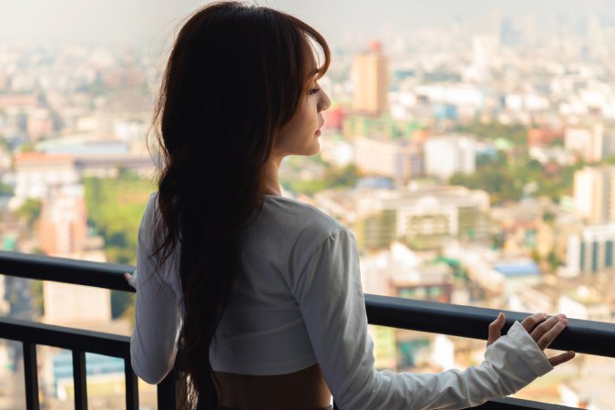 Tonnam bares her curves on the balcony, white top slipping as she poses topless against the city view — Tonnam #1