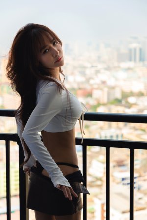 Tonnam bares her curves on the balcony, white top slipping as she poses topless against the city view — Tonnam #5