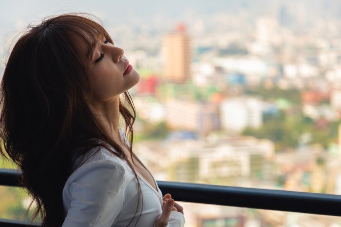 Tonnam bares her curves on the balcony, white top slipping as she poses topless against the city view — Tonnam #6