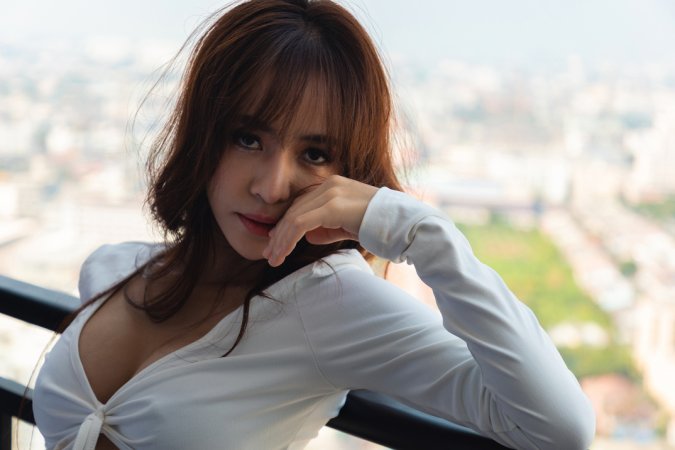 Tonnam bares her curves on the balcony, white top slipping as she poses topless against the city view — Tonnam #8