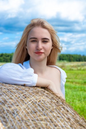 Melisa A spreads her legs on a hay bale under blue sky, white shirt open, red nails teasing her wet slit — Melisa A #2