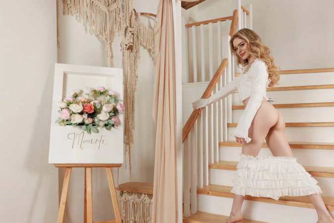 Mia M teases in white ruffles on the stairs, topless and playful with every pose she strikes — Mia M #9