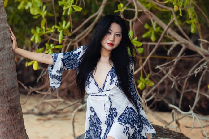 May starts poised in robe then bares all under palms her body telling a slow tease story — May #1