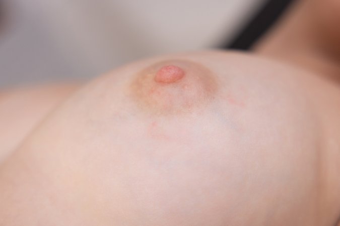 UNA FAIRY kneels and poses topless on a table, teasing with her curves and whispered moans — UNA FAIRY #4