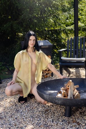 Posy bares all by the fire pit in her yellow robe, posing nude in the garden glow — Posy #1