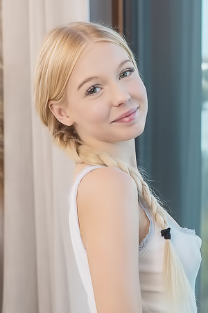 Liby teases on the bed by the window, posing nude with lingerie, spreading her legs for the city view