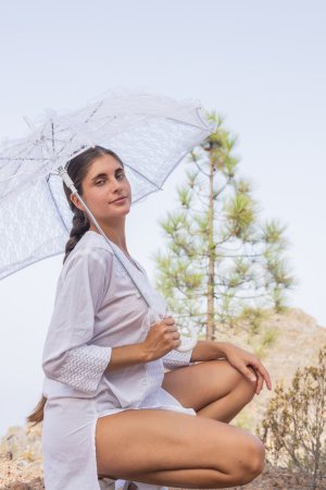 Esfinge squats bare bottom under clear umbrella in forest her white dress riding high — Esfinge #4
