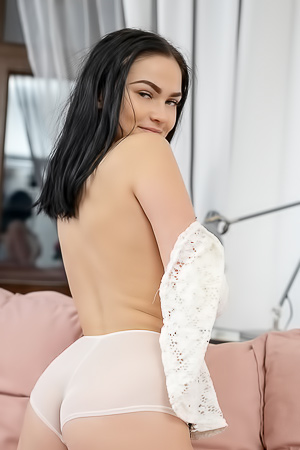 Mileva on the pink couch, teasing herself slow with her fingers, bedroom heat rising as she opens up