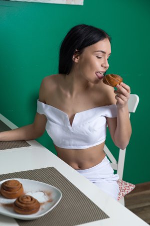 Diamond teases in the kitchen stripping white lingerie on a chair with green walls — Diamond #2