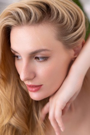 Lillie teases in green lingerie and nude poses on a white chair surrounded by plants in her bedroom — Lillie #9