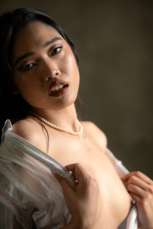 Minari commands the bedroom with languid nude poses, pearl necklace gleaming as she kneels and sprawls — Minari #4