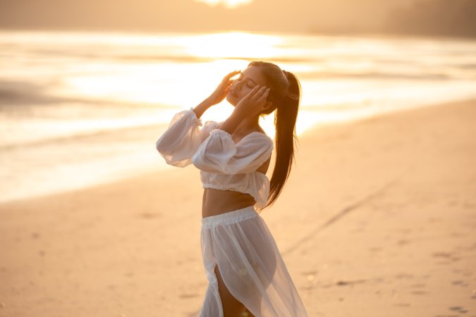 Sensual Bua bares her curves in sheer white lingerie on a golden beach at sunset posing solo — Bua #1