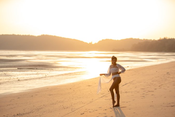 Sensual Bua bares her curves in sheer white lingerie on a golden beach at sunset posing solo — Bua #2