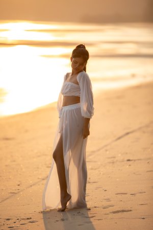 Sensual Bua bares her curves in sheer white lingerie on a golden beach at sunset posing solo — Bua #3