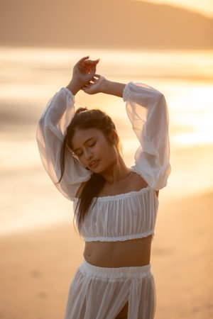 Sensual Bua bares her curves in sheer white lingerie on a golden beach at sunset posing solo — Bua #7