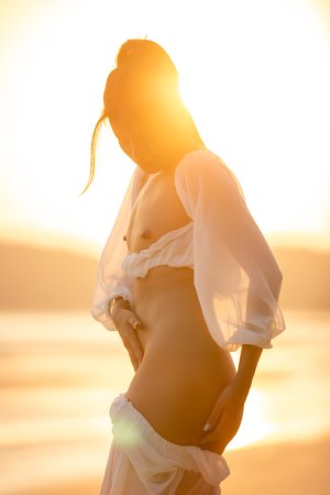 Sensual Bua bares her curves in sheer white lingerie on a golden beach at sunset posing solo — Bua #13