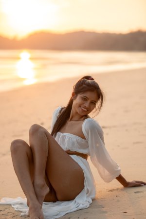 Sensual Bua bares her curves in sheer white lingerie on a golden beach at sunset posing solo — Bua #21