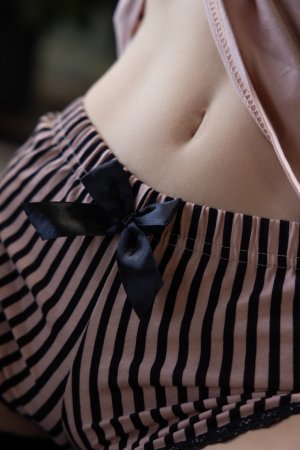 Alice Mido teases in black stockings and striped shorts, topless posing by the mirror with curls flowing — Alice Mido #2