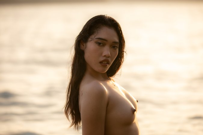 Minari bares all in the sea at sunset, posing nude with hands on her body, smiling — Minari #6