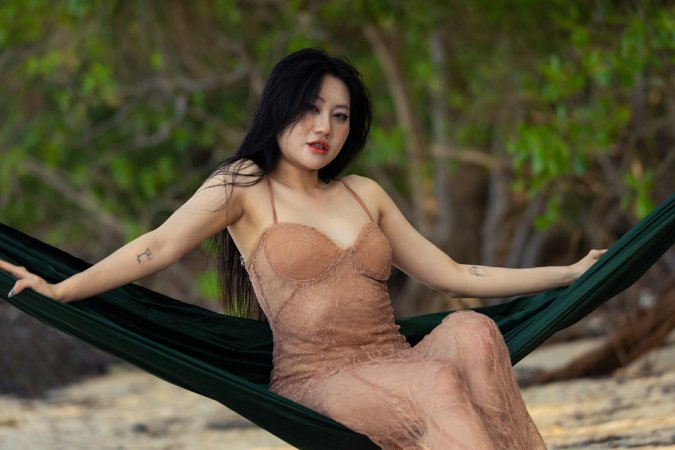 May Femjoy teases bare skin on beach hammock, slow lace reveal under tropical sun — May Femjoy #1