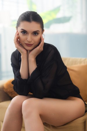 Julia K. in black shirt teasing on couch bare ass and pussy exposed through sheer fabric — Julia K. #4