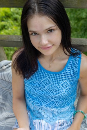 Matty posing topless on wooden deck outdoors holding pencil natural light solo brunette — Matty #1